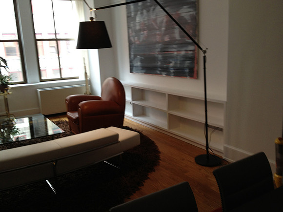 Custom built-in bookshelves and wall unit at white bookcase West 30th str, Manhattan by OzanCraft NYC.