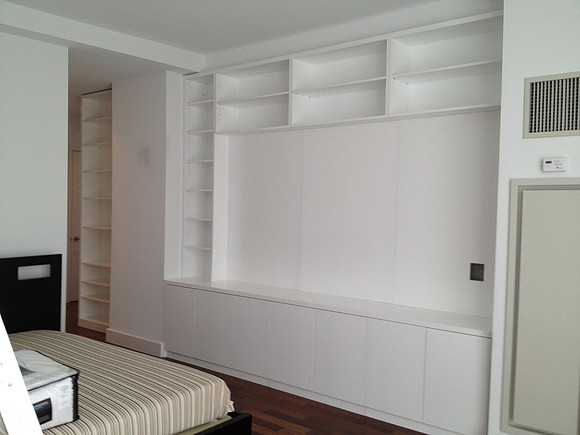 Custom built-in bookshelves and wall unit at Luxury High-rise Azure Condominium  E 91 str.  White Built-in Wall Unit Modern Wall Unit, Manhattan by OzanCraft NYC.