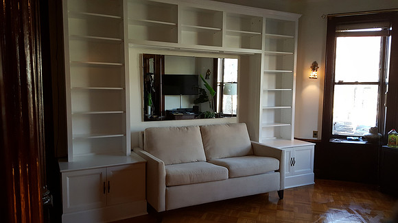 Custom built-in bookshelves and wall unit at Bay Ridge, Brooklyn Custom Bookcase around the Sofa, Manhattan by OzanCraft NYC.