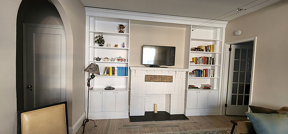 Custom built-in bookshelves and wall unit at 21 East 10th street built in Bookcase around the fireplace., Manhattan by OzanCraft NYC.
